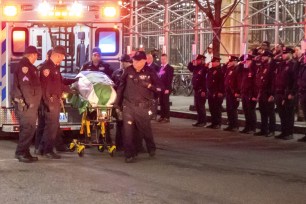 NYPD lines up andf the Cirty Morgue in Manhattan to honor fellow office Jonathan Diller, 31, who was shot dead during a traffic stop in Queens.