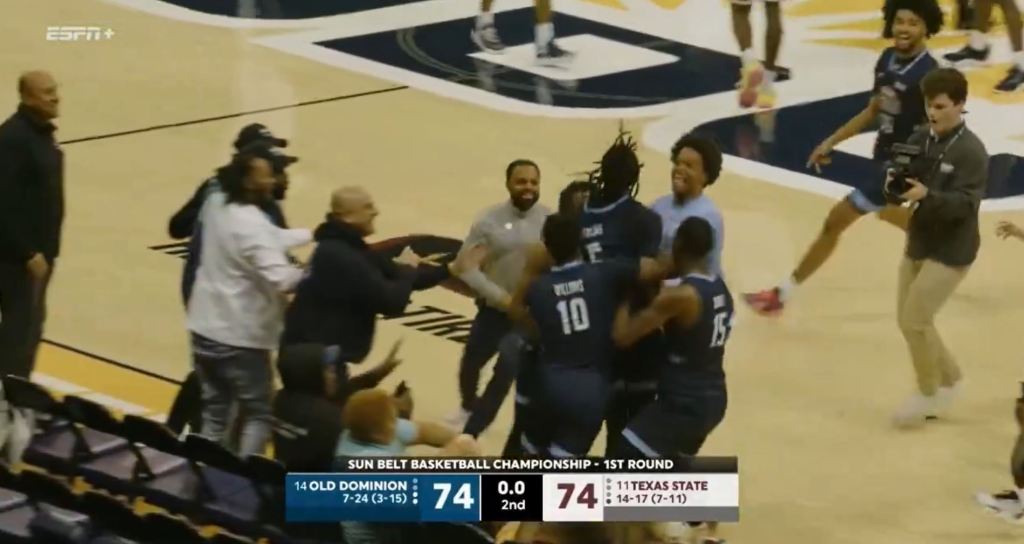 Chaunce Jenkins celebrates with Old Dominion teammates after thinking they won.