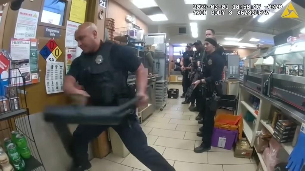 Police used a battering ram to get into the back room of the store.