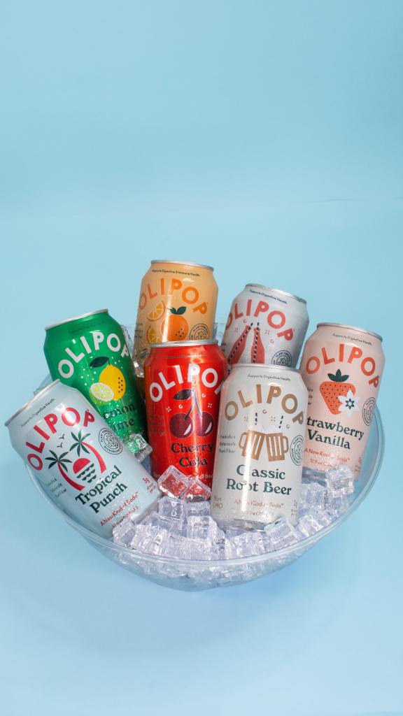 Two cans of OLIPOP soda in a bowl of ice.