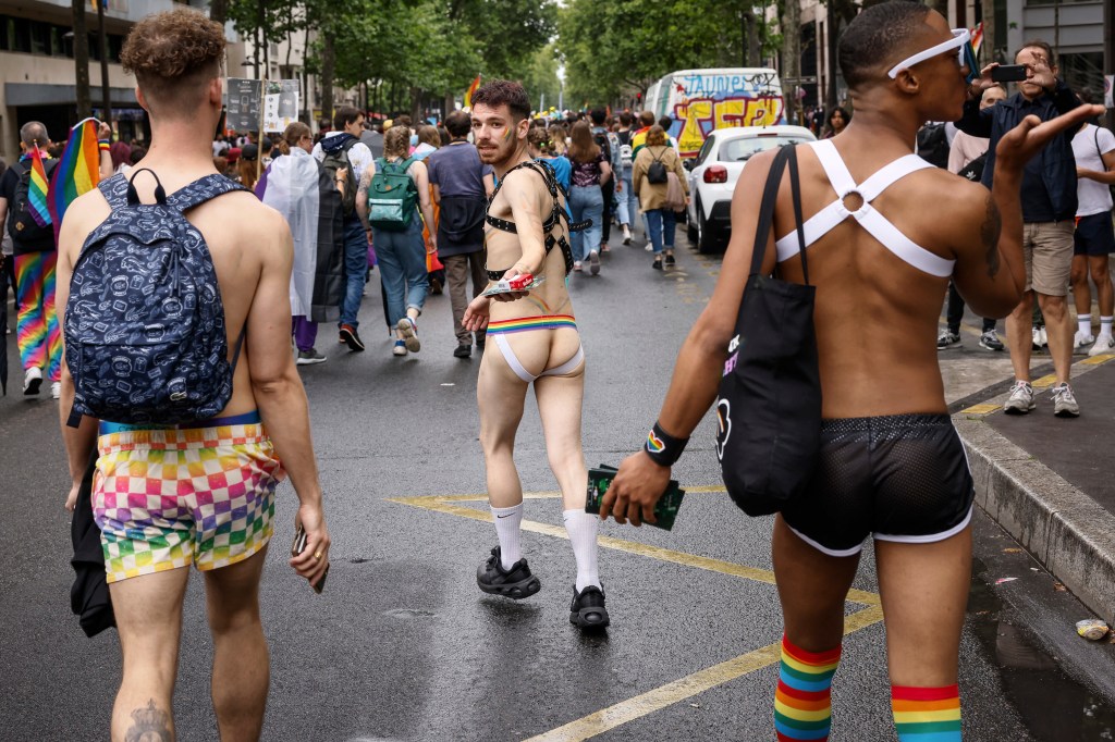 The jockstrap owes a debt to the gay men who have embraced it — including at this 2022 Pride Paris march — since the 1950s.