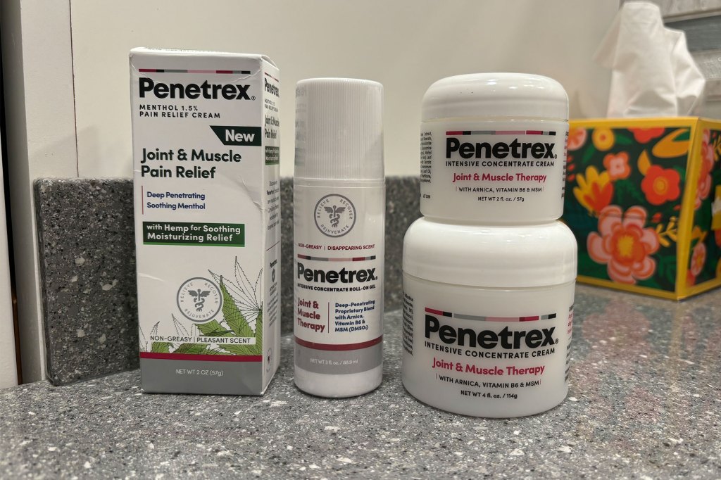 White containers with red text on them - Penetrex Products.