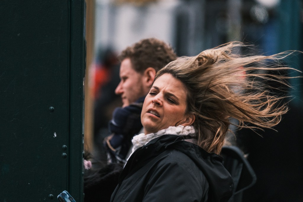 A woman battling the strong winds in lower Manhattan on March 11, 2024.