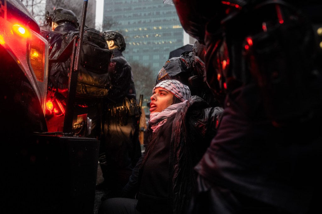 People are detained by NYPD officers during a protest in support of Palestine in Manhattan, New York