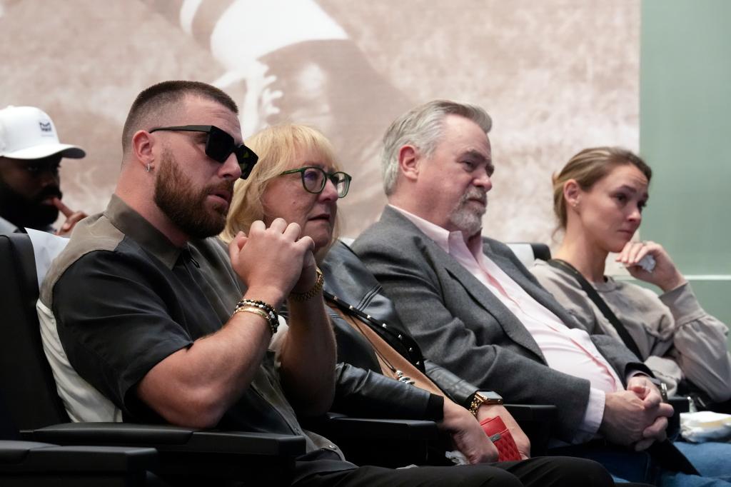 Jason Kelce's family, from left, Kansas City Chiefs' Travis Kelce, mother, Donna Kelce, father, Ed Kelce, and wife, Kylie McDevitt Kelce, listens as Jason Kelce announces his retirement