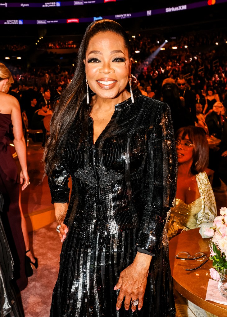 Oprah Winfrey wearing a black dress at the Grammys.