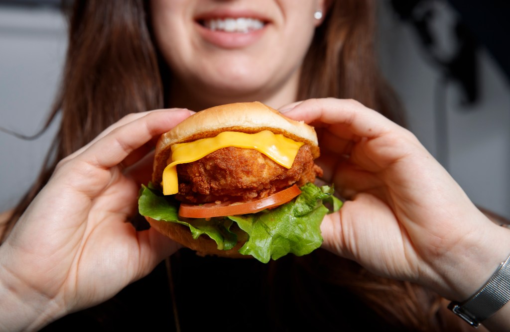 A woman holding a Chick-fil-A sandwich in New York on April 23, 2018