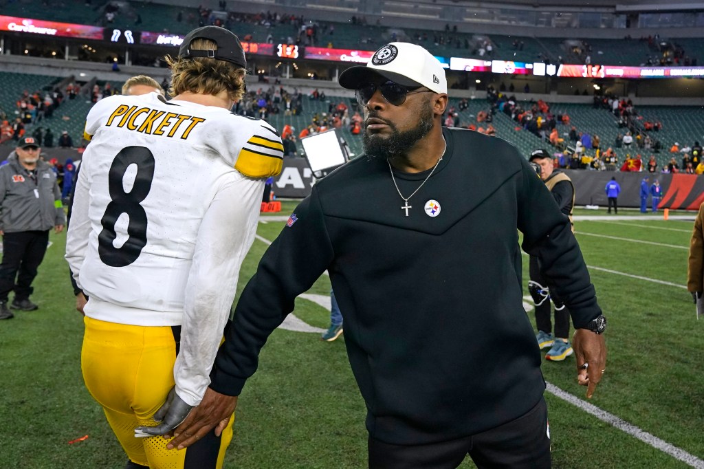 Pittsburgh Steelers head coach Mike Tomlin, right, and quarterback Kenny Pickett walk off the field following an NFL football game against the Cincinnati Bengals in Cincinnati, Sunday, Nov. 26, 2023.  