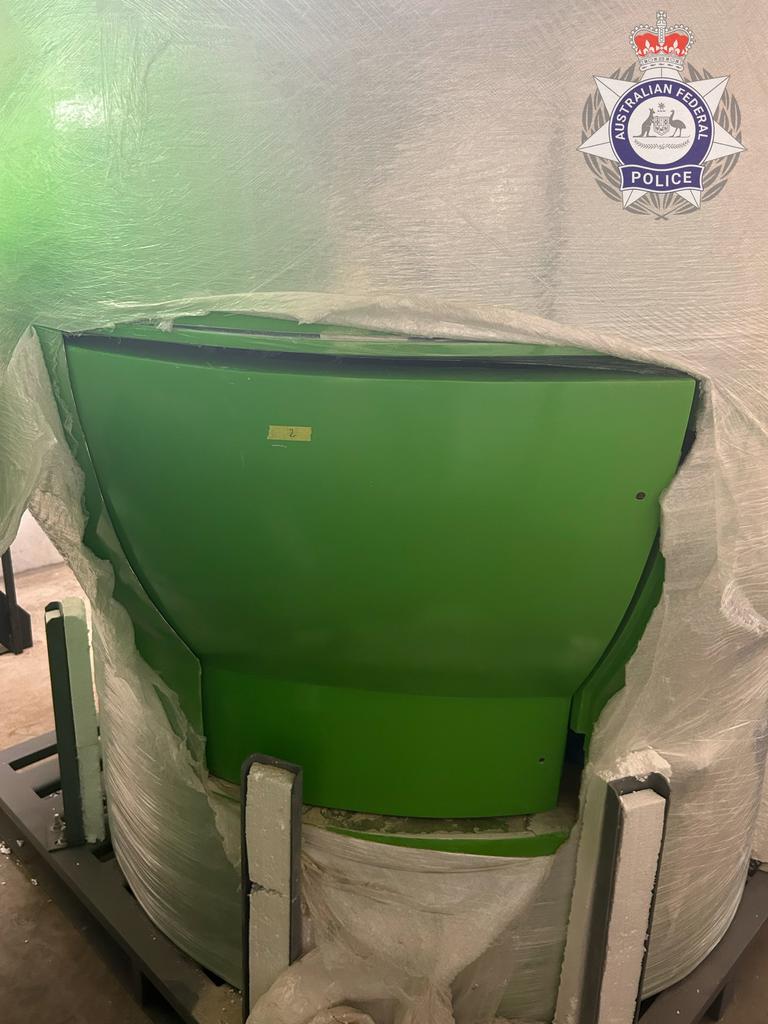 Police allege the men used various tools to open parts of the kiosks, including sections where the cocaine had been removed by Brazilian authorities.