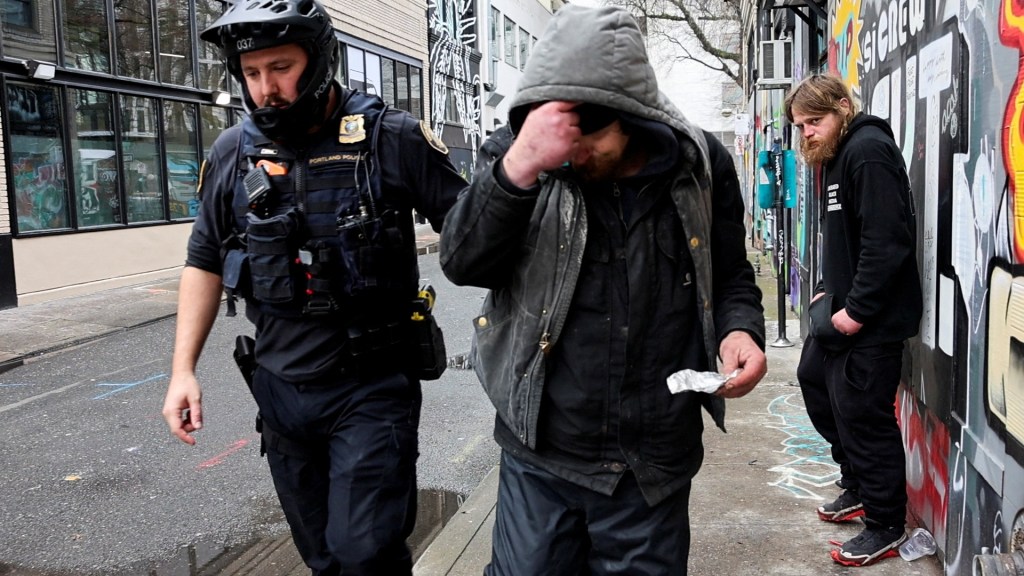 Portland police officer David Baer pulls a man smoking fentanyl to issue him a citation on Feb. 7, 2024.