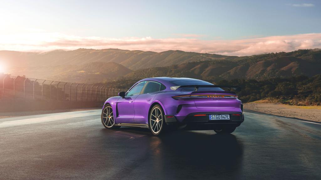 A purple Porsche Taycan Turbo GT racing car on a road, the most powerful EV with 1,093 horsepower, available for pre-order starting at $230,000.