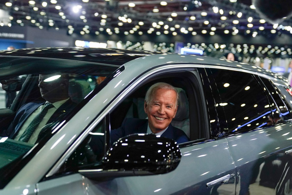 President Biden in electric car