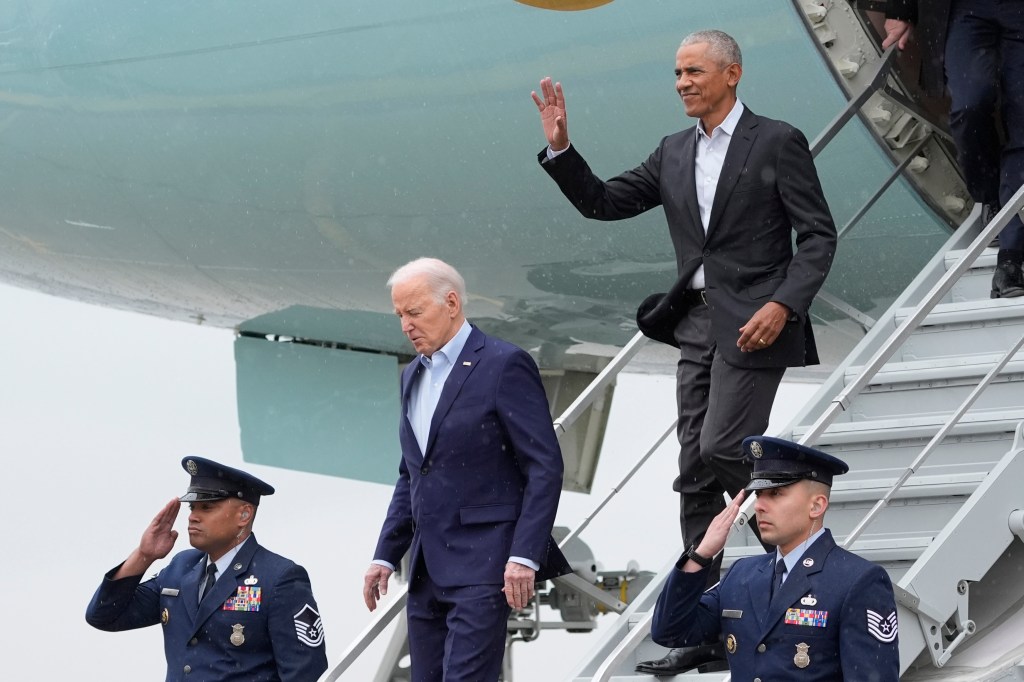 President Joe Biden, from second left, exits Air Force One with former President Barack Obama at John F. Kennedy International Airport,