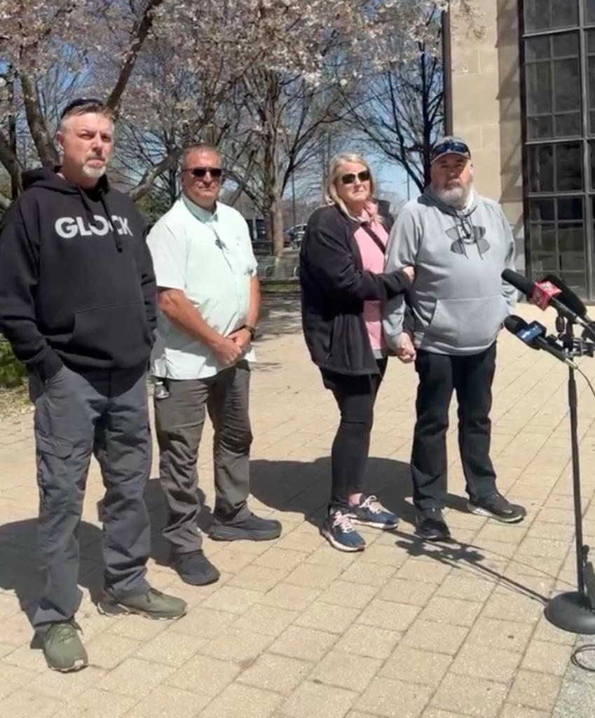 Strain's family at a press conference on the search for their missing son on March 19, 2024.