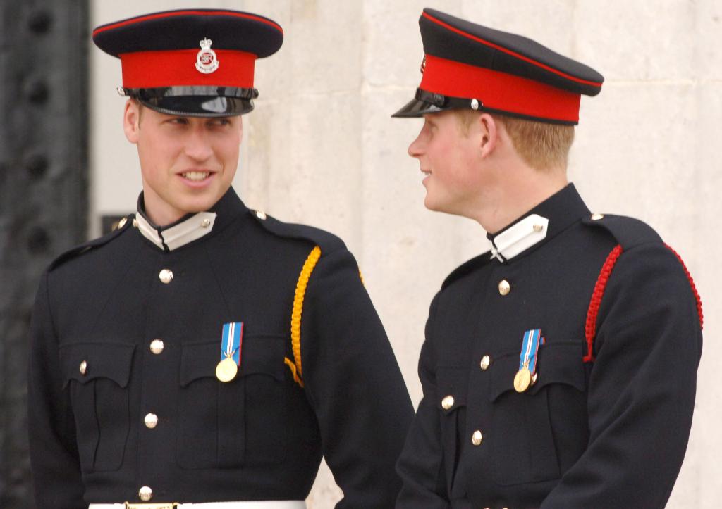 Prince William smiling at Prince Harry when they were younger. 