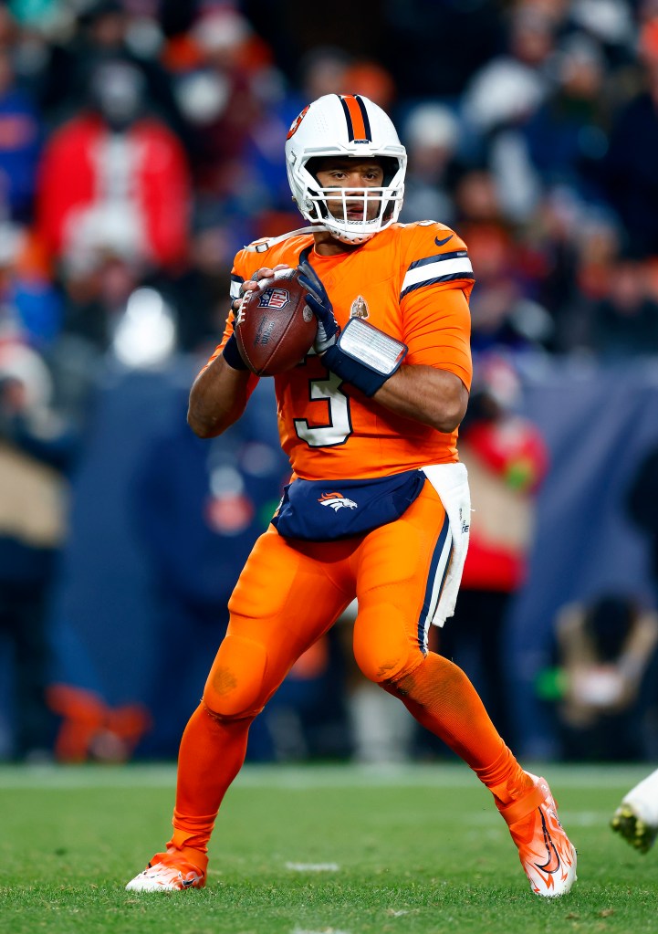 Quarterback Russell Wilson #3 of the Denver Broncos passes during the 2nd quarter of the game against the New England Patriots at Empower Field At Mile High on December 24, 2023 in Denver, Colorado.  