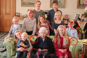 The Queen is seen in this photo sitting on a couch with 10 of her grandchildren and great-grandchildren inside Balmoral Castle.