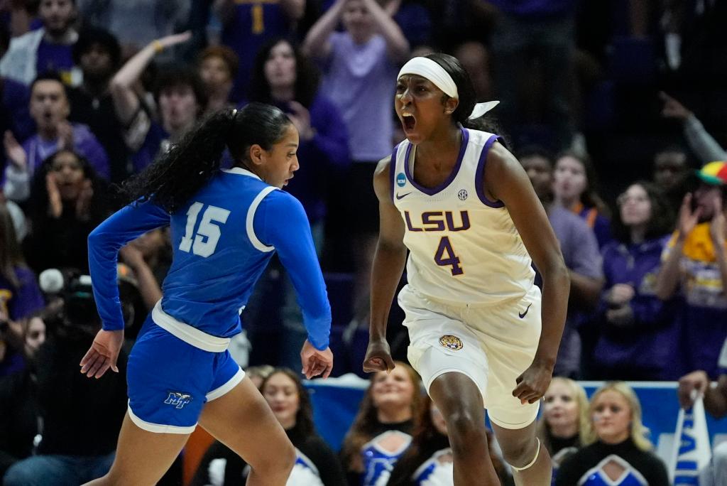 LSU guard Flau'jae Johnson (4) reacts after scoring a 3-point basket during the first half.