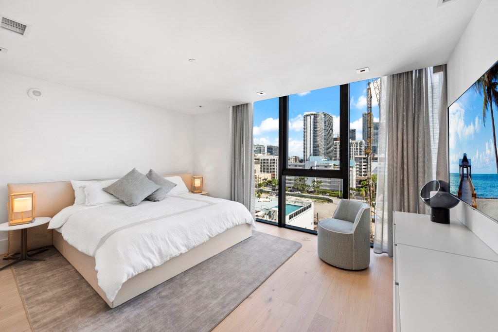 One of the bedrooms -- this one looks out to city views.