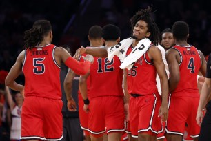 Glenn Taylor Jr. #35 of the St. John's Red Storm reacts with Daniss Jenkins #5 in the first half against the Seton Hall Pirates.