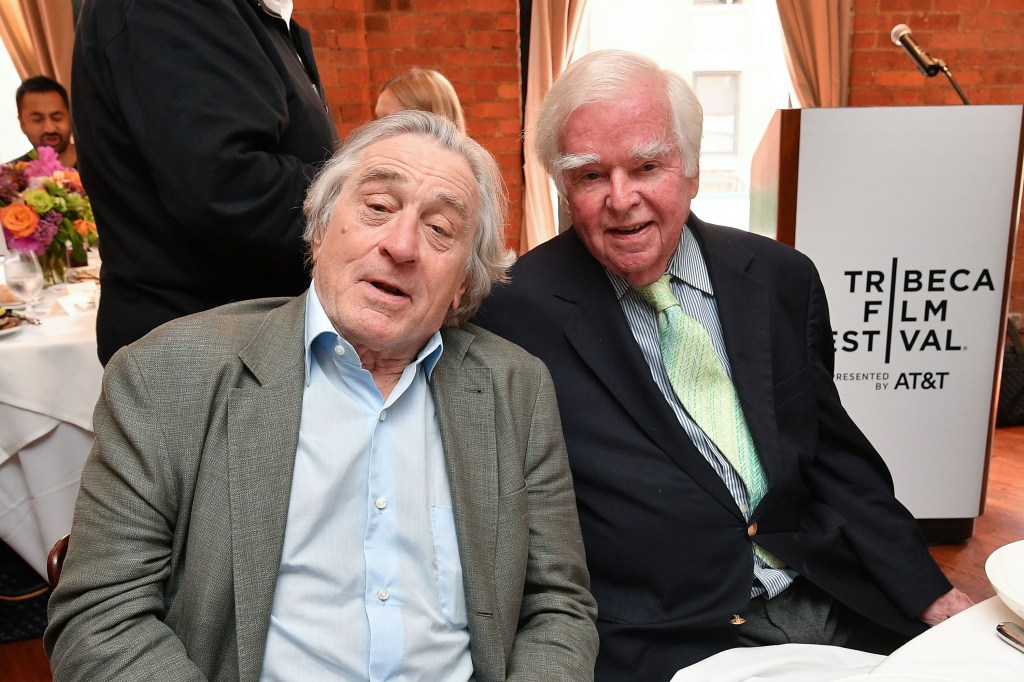 Robert De Niro and honoree Dr. Kevin Cahill sitting at a lunch table at Tribeca Grill Loft during the 2019 Tribeca Film Festival.