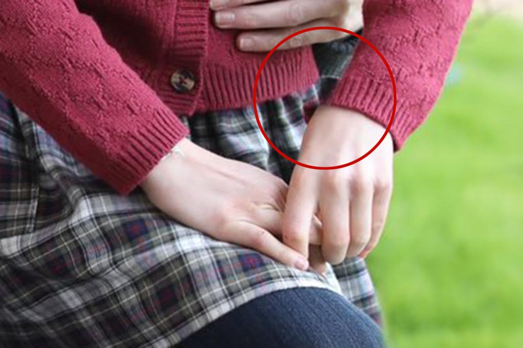 A cropped details of a photo showing Kate and Charlotte's hands which appear to have been edited