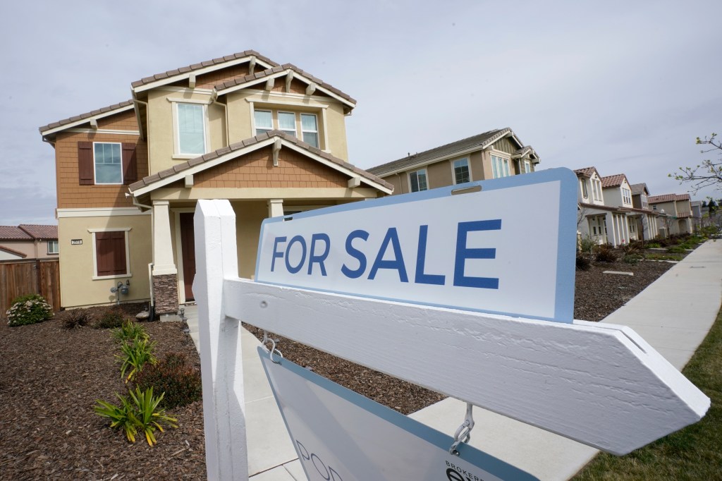 A 'for sale' sign posted in front of a home in Sacramento, California, indicative of the rising U.S. home prices in 2023