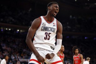 Samson Johnson #35 of the Connecticut Huskies reacts after scoring in the second half against the St. John's Red Storm during the Semifinal round of the Big East Basketball Tournament.