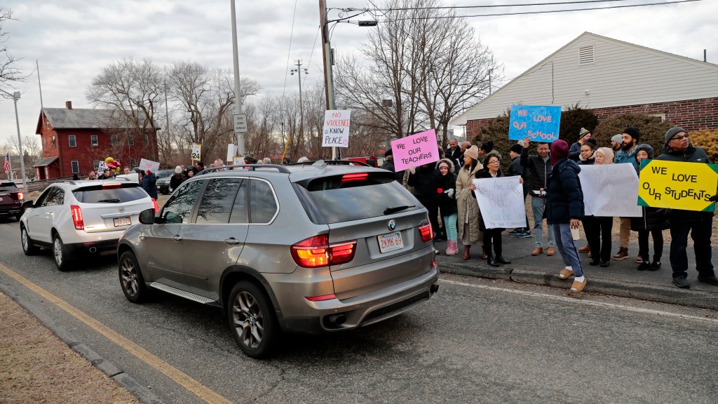 Parents and community members outside Brockton High after the school committee asked for the National Guard's help