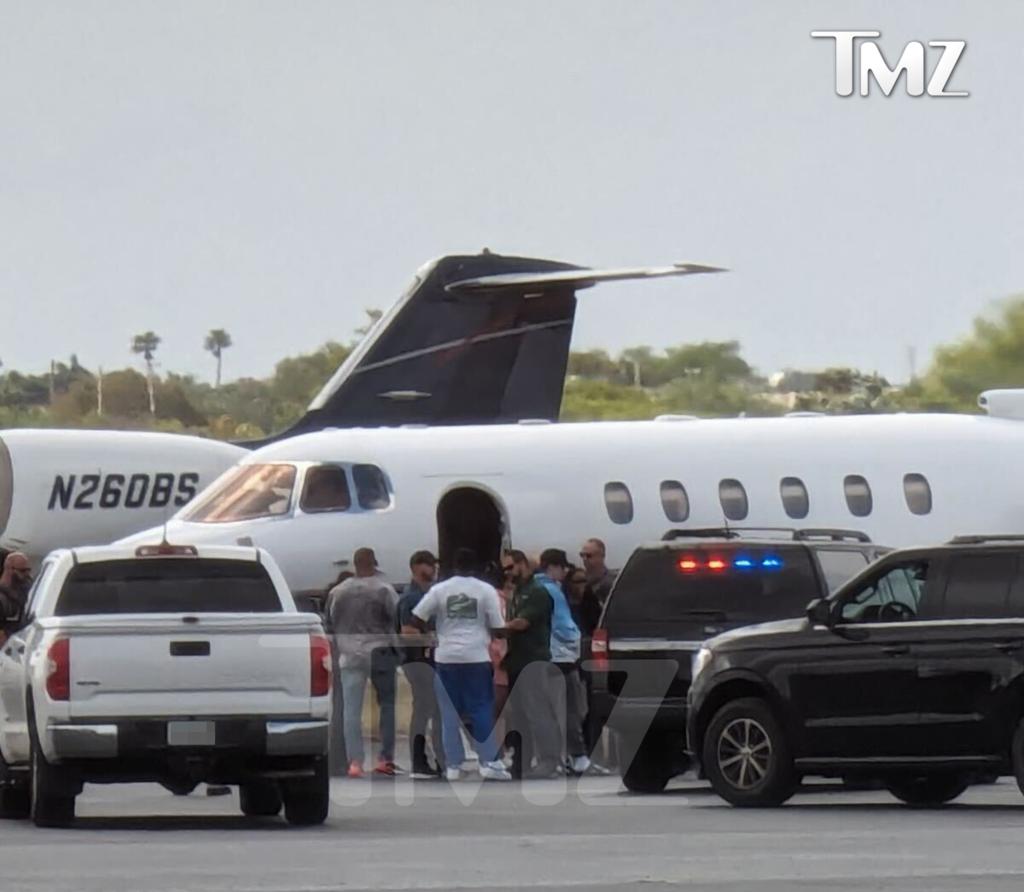 Sean "Diddy" Combs was seen speaking to federal agents at an airport Monday after they intercepted his plane following a raid at his Los Angeles and Miami homes.