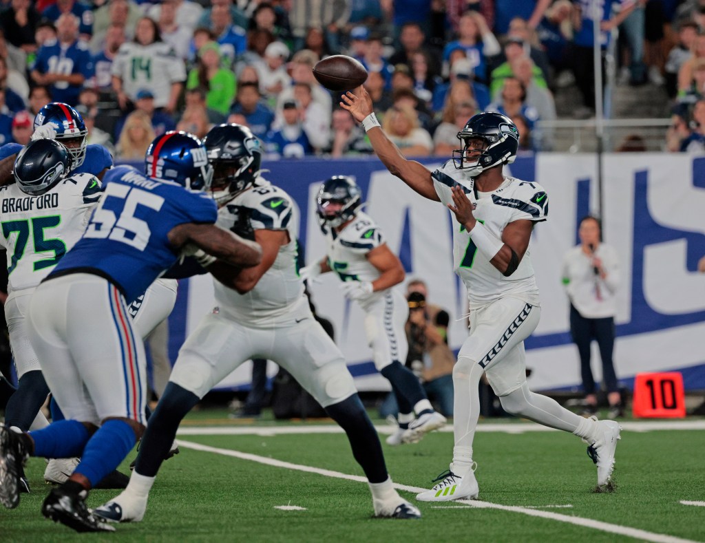 Seahawks quarterback Geno Smith #7 throws a pass during the first half.