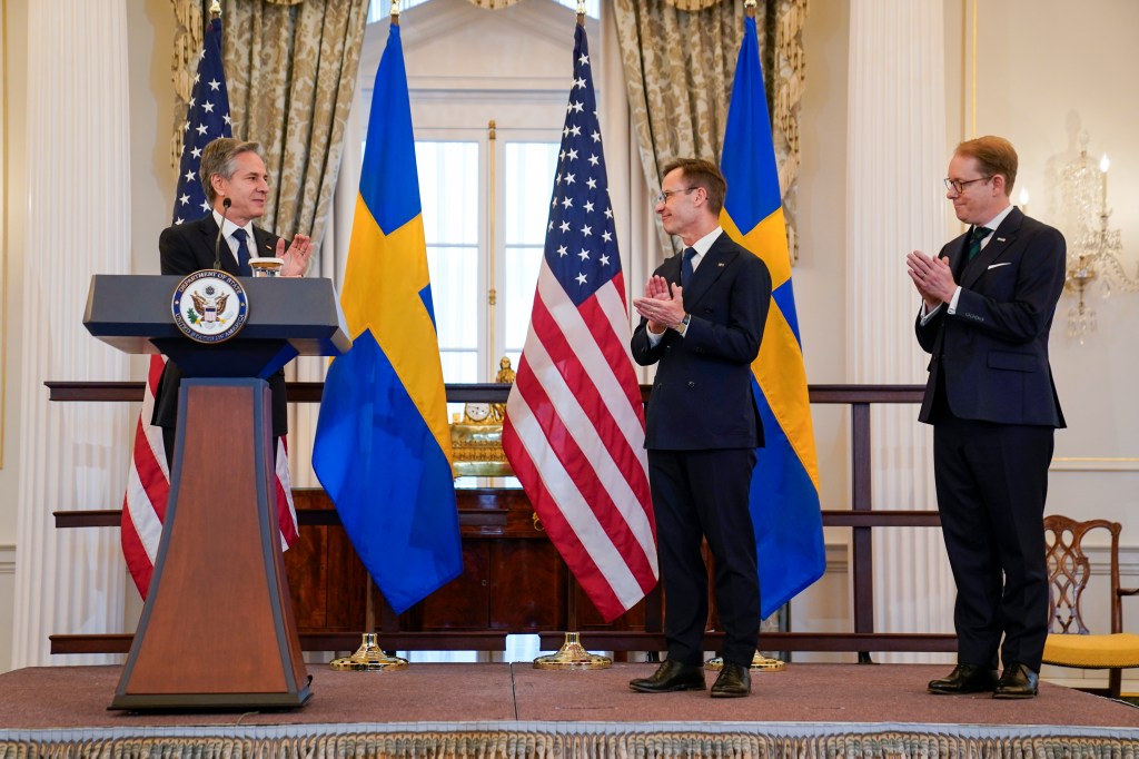 Secretary of State Antony Blinken, from left, speaks after presenting Swedish Prime Minister Ulf Kristersson with Sweden's NATO Instruments of Accession as Swedish Foreign Affairs Minister Tobias Billström looks on in the Benjamin Franklin Room at the State Department, Thursday, March 7, 2024, in Washington.