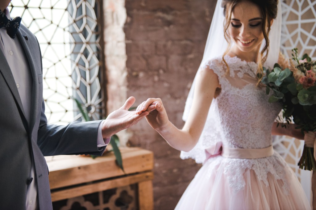 The first look allows couples to get their wedding pictures taken care of before the ceremony.