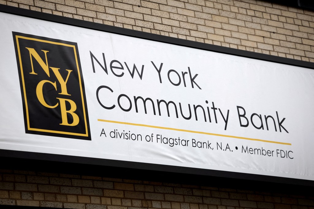 Branch of New York Community Bank with sign above on brick wall.