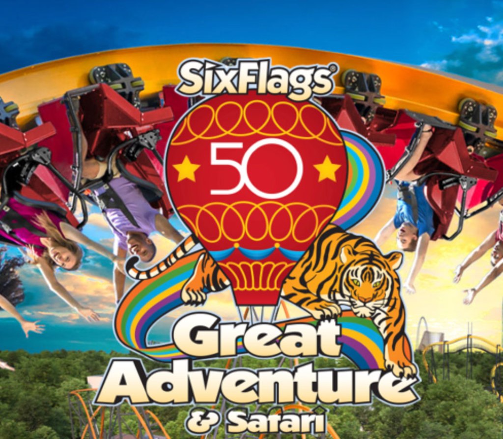 The 50th anniversary poster for Six Flags Great Adventure and Safari features a hot air balloon with a giant "50," backed by a tiger and riders on an upside down roller coaster above it.