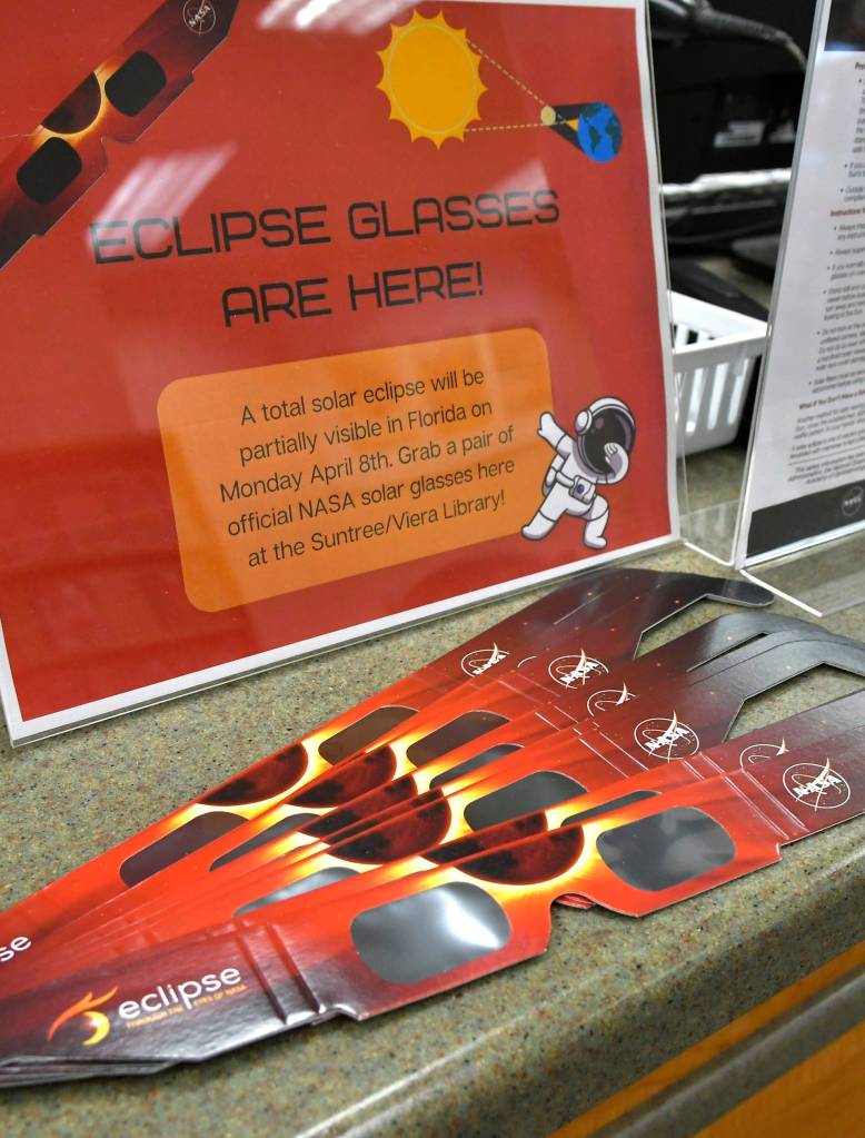 A group of solar eclipse glasses available for pick up at Suntree Viera Library Children's Department.