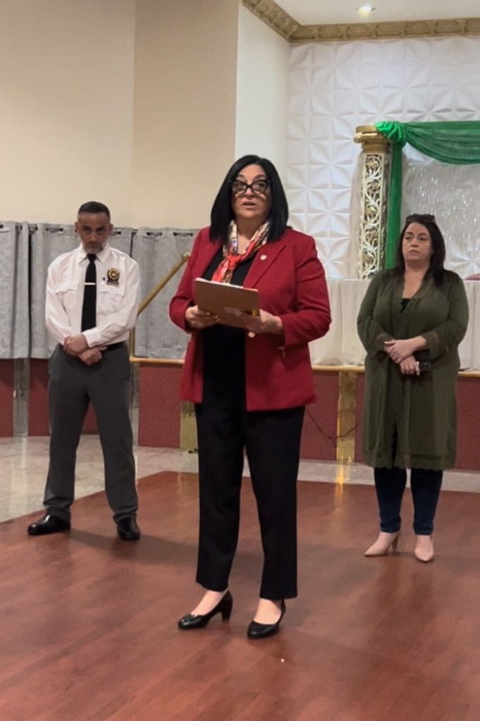 Councilwoman Joann Ariola speaking at an Ozone Park Block Association meeting, with her chief of staff Phyllis Inserillo standing to the right and sergeant-at-arms at left.