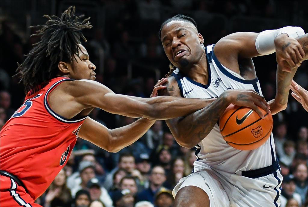 Glenn Taylor Jr. (35) attempts to steal the ball from Butler Bulldogs guard Jahmyl Telfort (11) during the first half at Hinkle Fieldhouse.