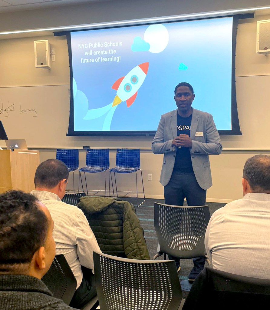 Jason Green, Co-Founder and Co-CEO of LINC Learning, speaking to NYC teachers in front of a screen