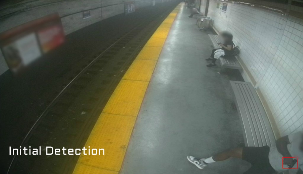 Man sits on subway bench with gun in hand in rendering.