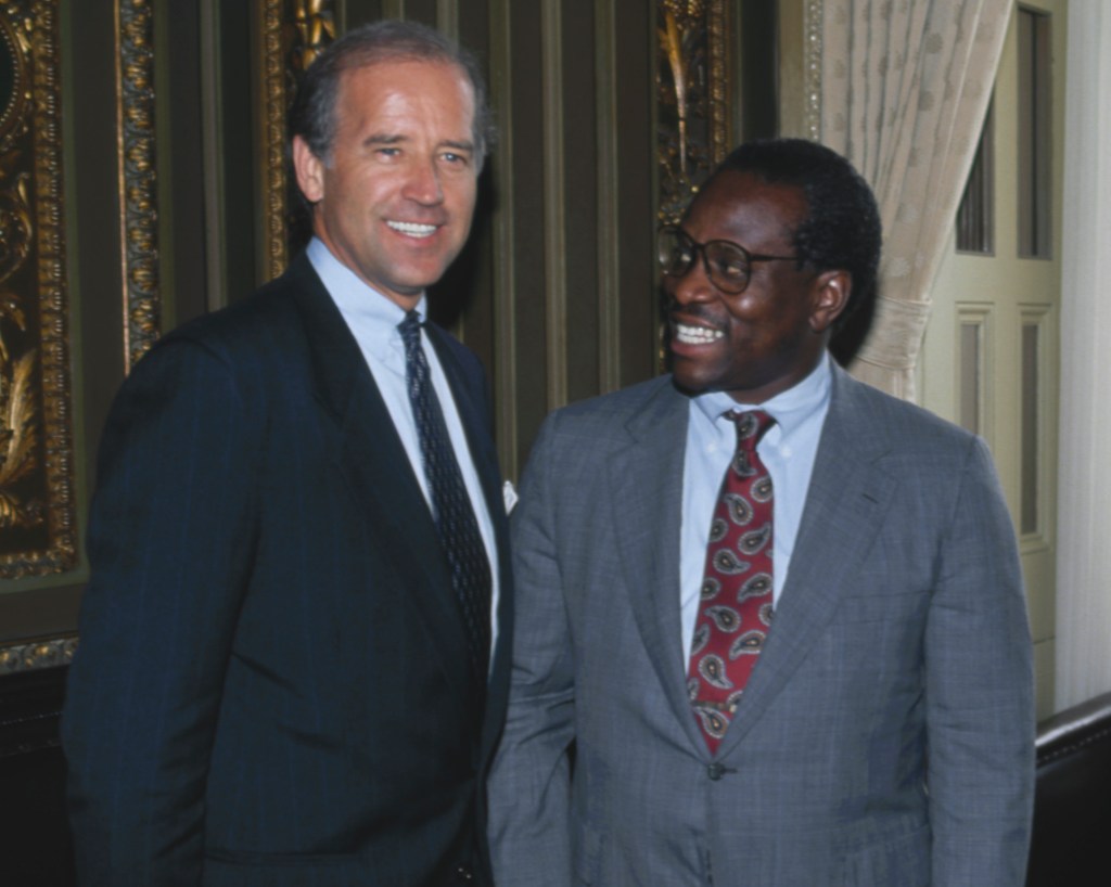 Supreme Court Justice nominee Judge Clarence Thomas, right, poses with Senate Judiciary Committee chairman Senator Joe Biden, in Washington, DC, July 9, 1991.