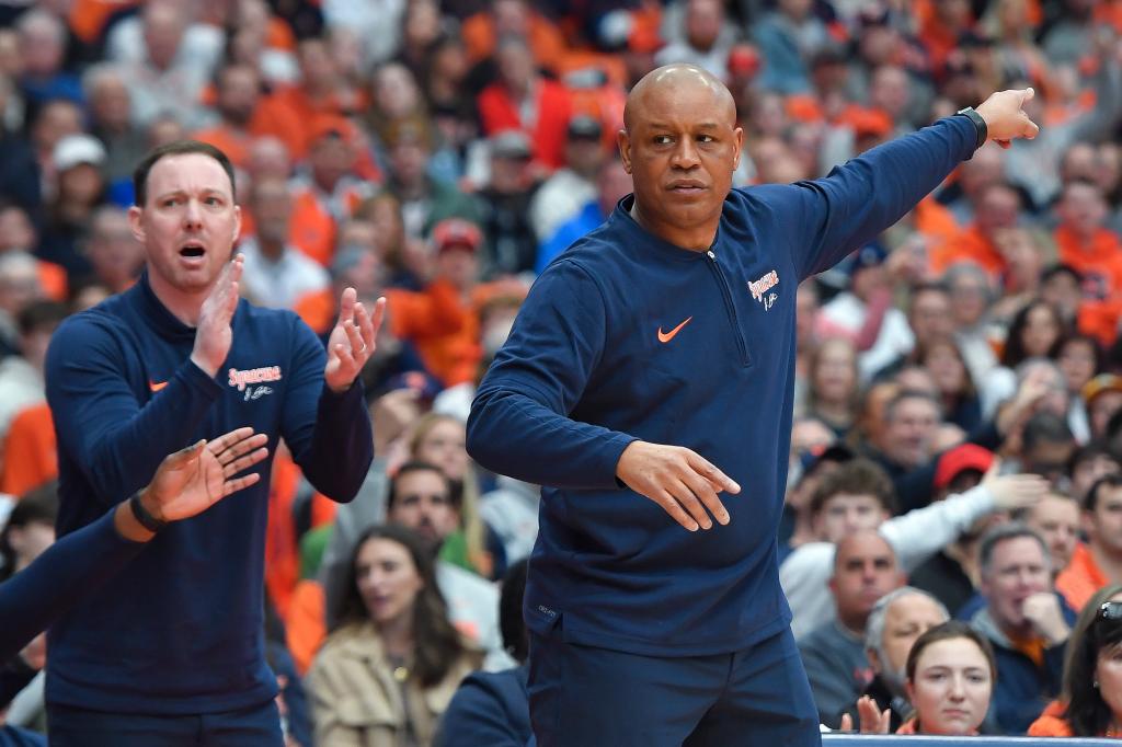 Gerry McNamara (l) next to Syracuse coach Adrian Autry (r).