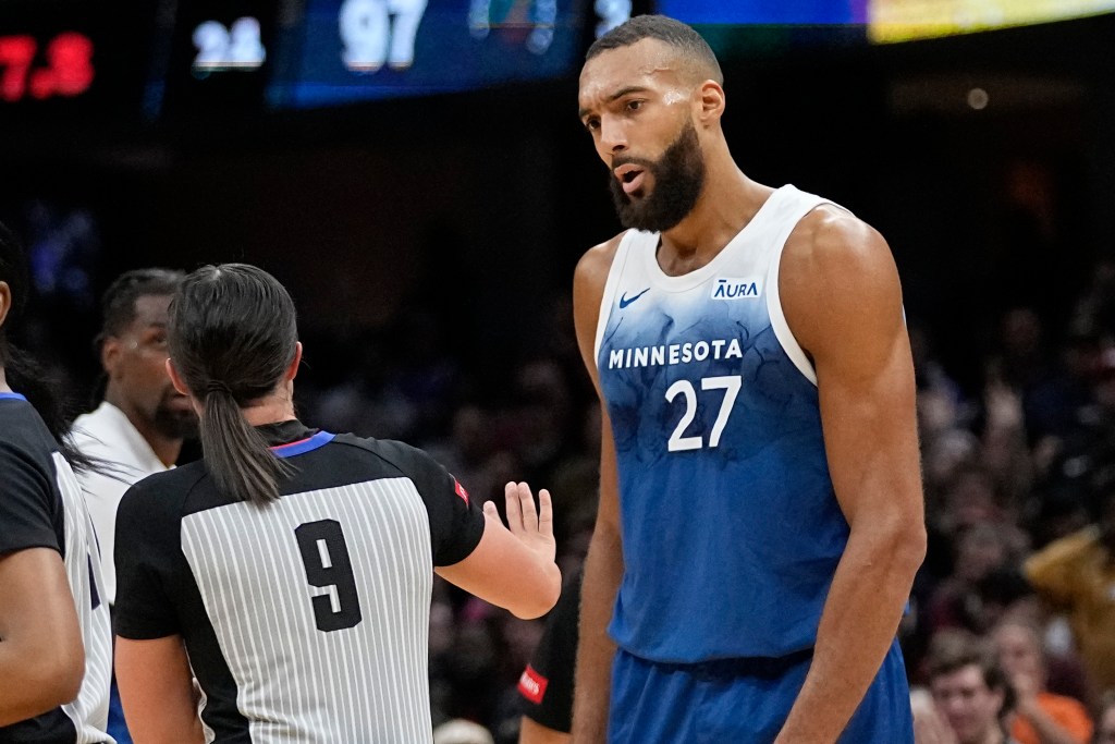 Minnesota Timberwolves center Rudy Gobert (27) talks with referee Natalie Sago (9) after being called for a technical foul in the second half of an NBA basketball game against the Cleveland Cavaliers, Friday, March 8, 2024, in Cleveland.