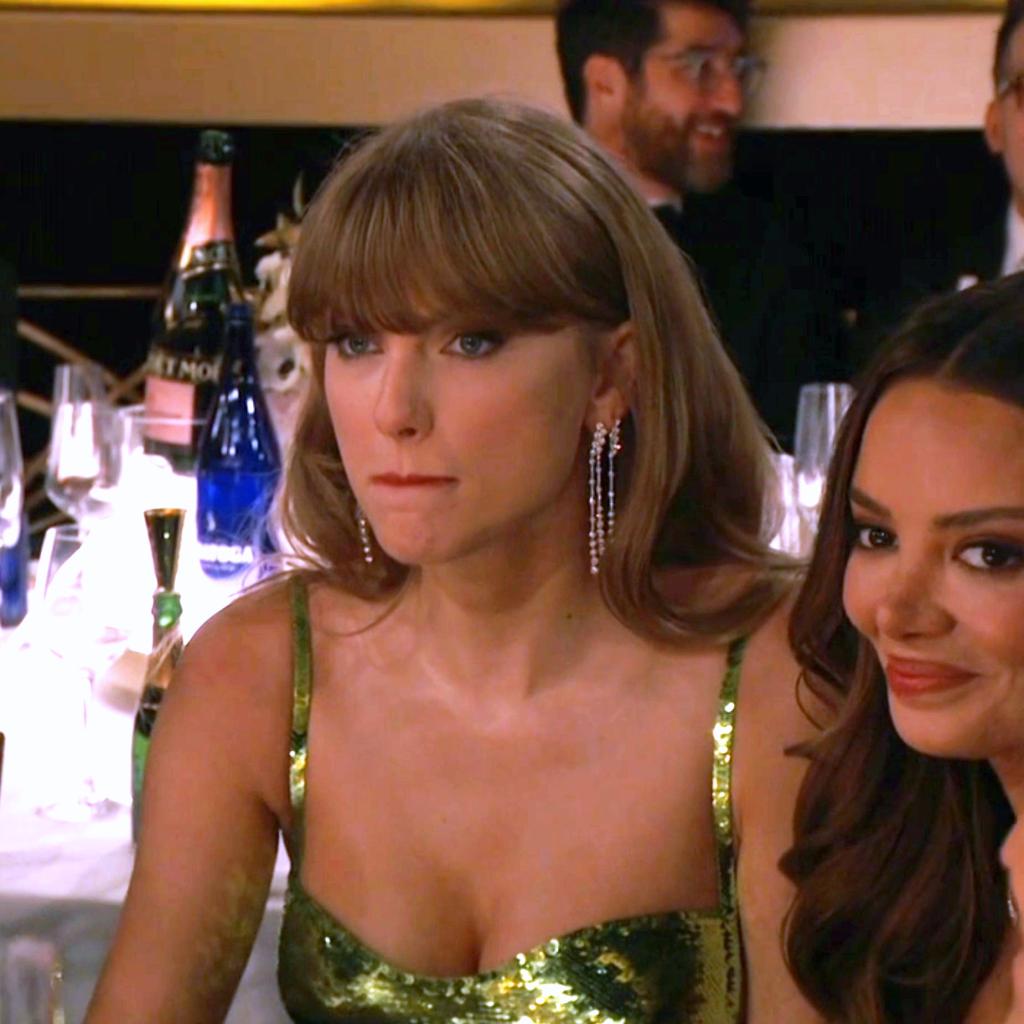 Taylor Swift appears annoyed at a joke told by host Jo Koy at her expense at the Golden Globes, Jan. 7 on CBS.