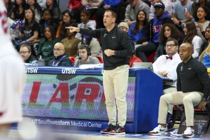 Temple Owls head coach Adam Fisher gives direction during the game between the SMU Mustangs and Temple Owls.