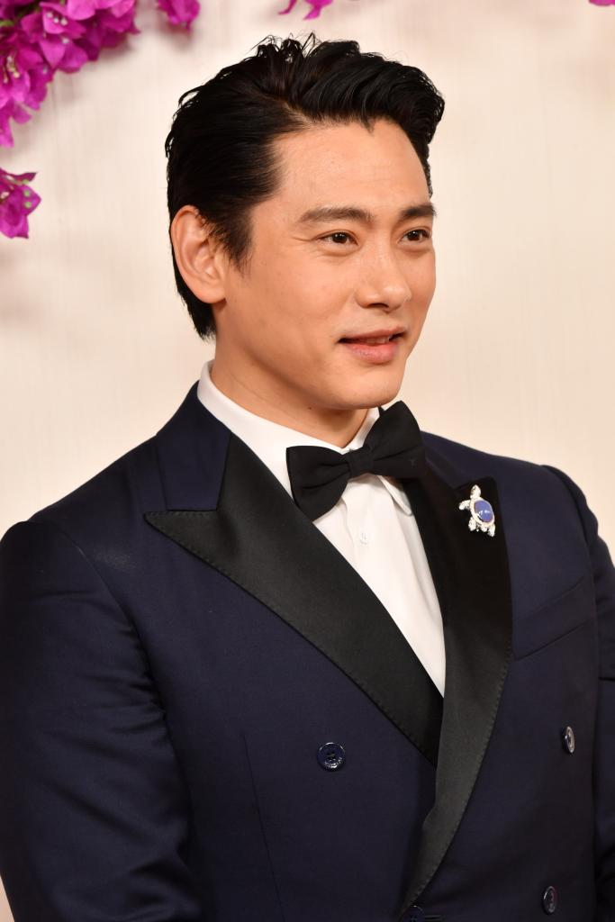 Teo Yoo, who starred in the Best Picture nominee "Past Lives," revealed that he wore a turtle pin to the 2024 Oscars on Sunday in memory of his pet tortoise who died in August 2023. 