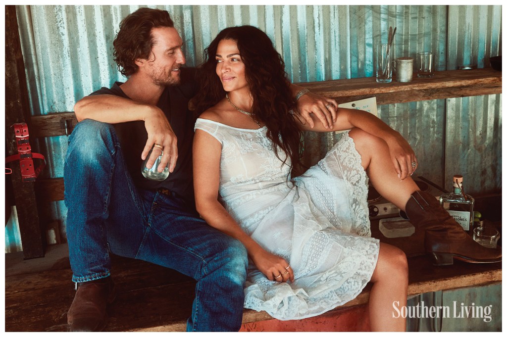 Matthew McConaughey and his wife, Camila, smiling at each other. 