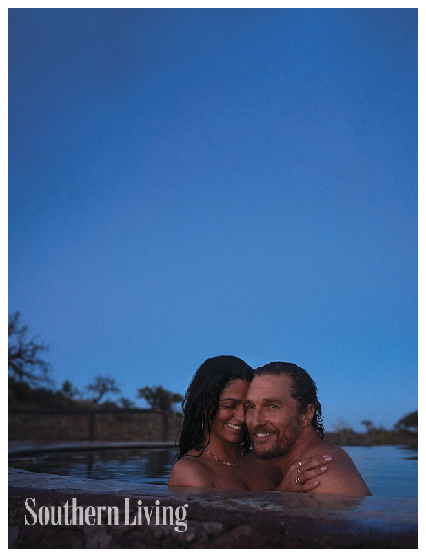 Matthew and Camila McConaughey hugging in water. 