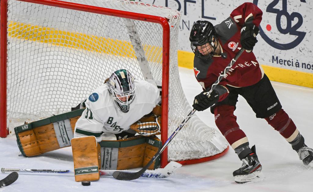 Laura Stacey (7) tries a wrap-around attempt on Boston goaltender Aerin Frankel during the third period.