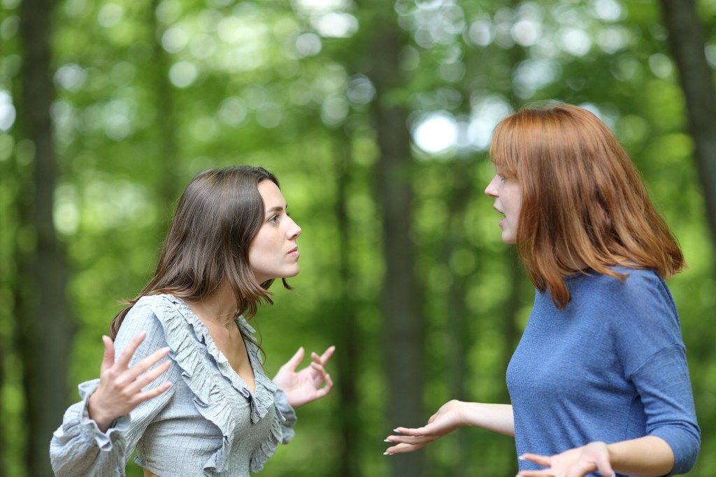 Two women arguing in a forest